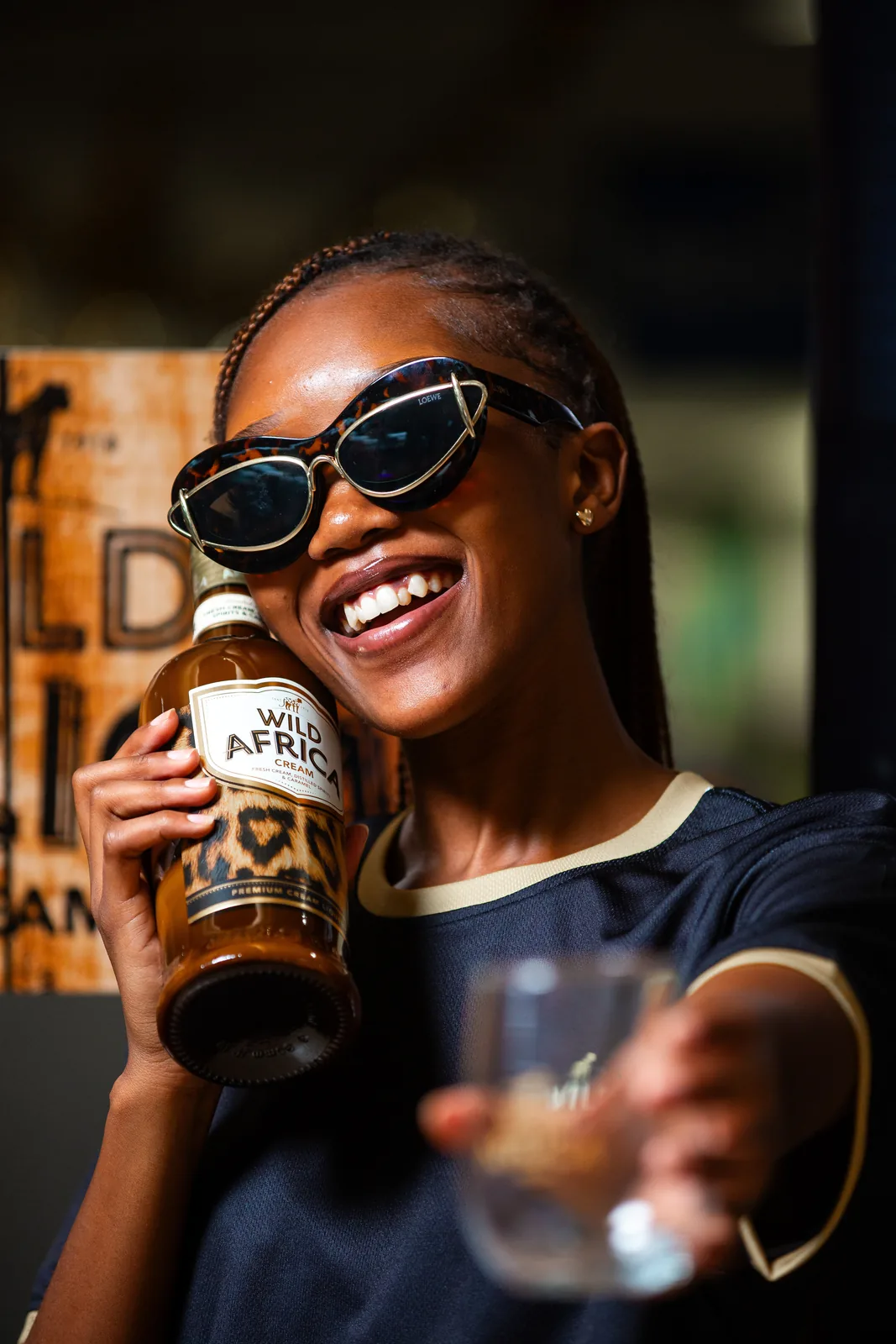 A smiling guest at the Wild Africa brand experience, photographed by True Virtue Media