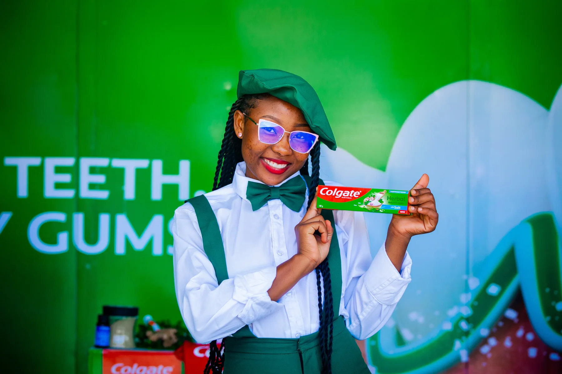 Colgate brand ambassador presenting Colgate Herbal toothpaste